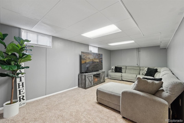 living room with carpet flooring and a drop ceiling