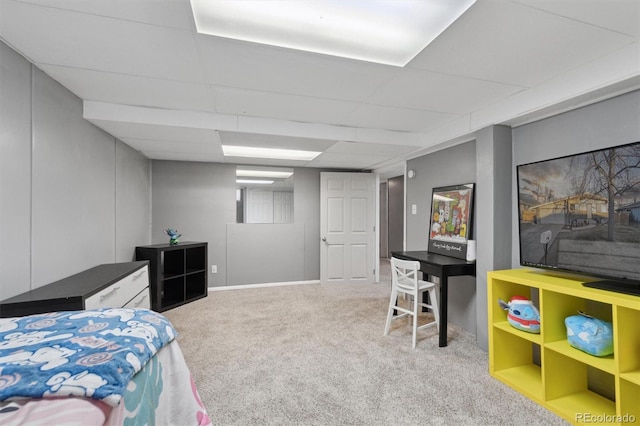 carpeted bedroom featuring a paneled ceiling