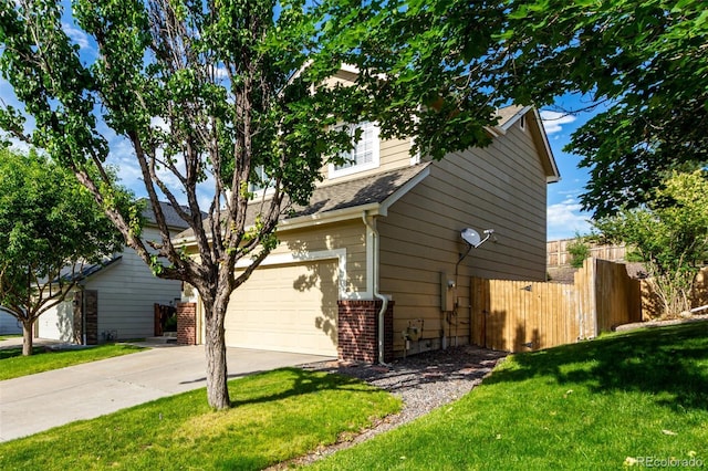 5972 S Zante Way, Aurora, CO 80015 - view of home's exterior featuring a garage, driveway, and a shingled roof