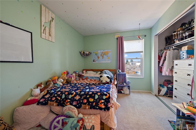 bedroom with carpet floors and baseboards