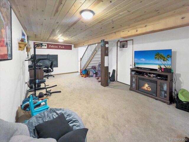 recreation room with carpet floors and wood ceiling