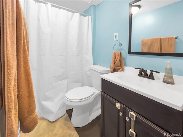 bathroom featuring vanity, toilet, and a shower with curtain