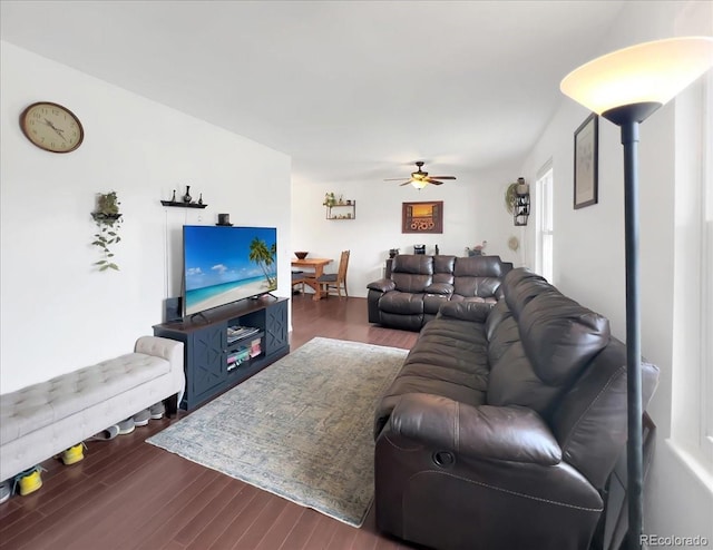 living area with ceiling fan and wood finished floors