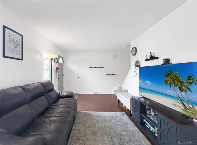 living room with wood finished floors