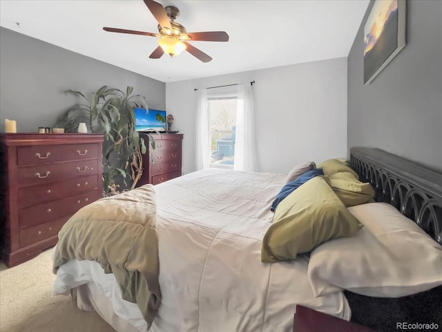 carpeted bedroom with a ceiling fan