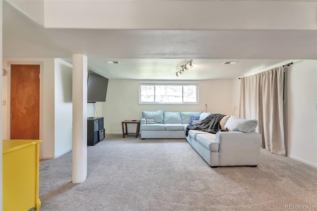 living area with carpet flooring and baseboards