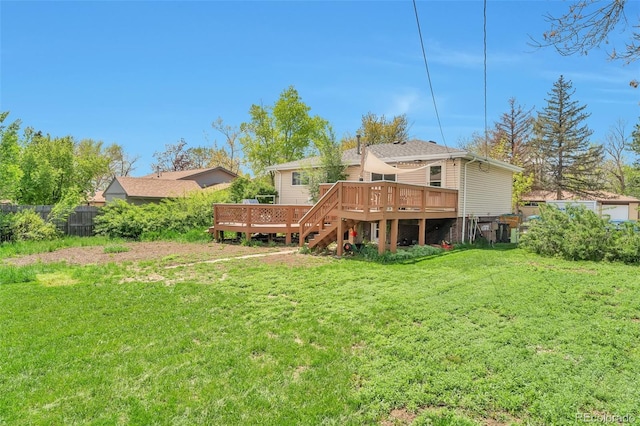 rear view of property with a wooden deck