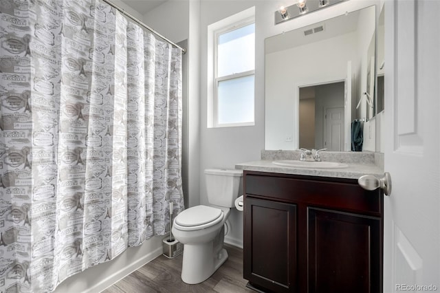 18199 E 96th Ave, Commerce City, CO 80022 - bathroom with toilet, wood finished floors, and vanity