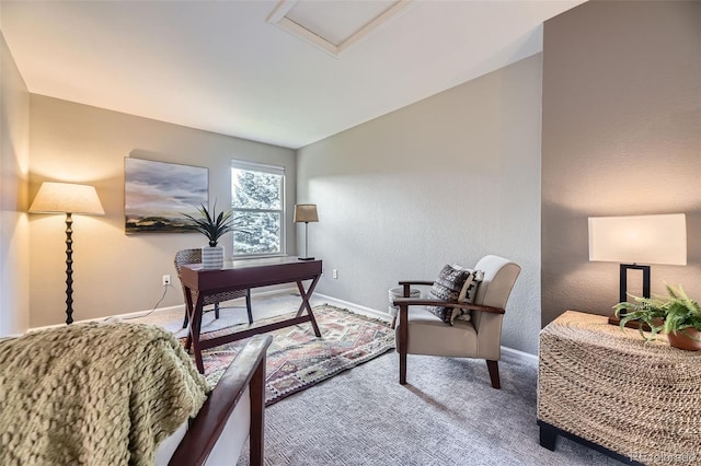 carpeted office space with attic access, baseboards, and lofted ceiling