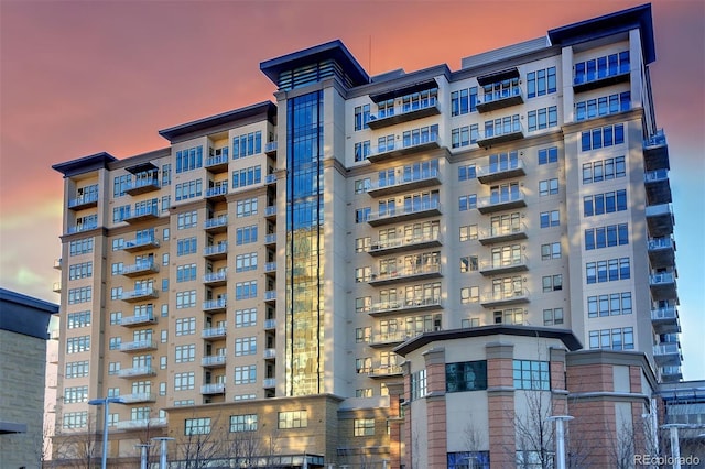 view of outdoor building at dusk