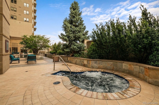 view of patio / terrace featuring a community hot tub