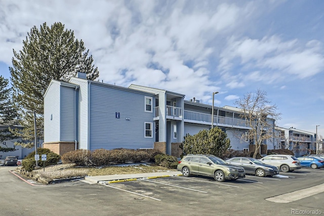 view of property featuring uncovered parking