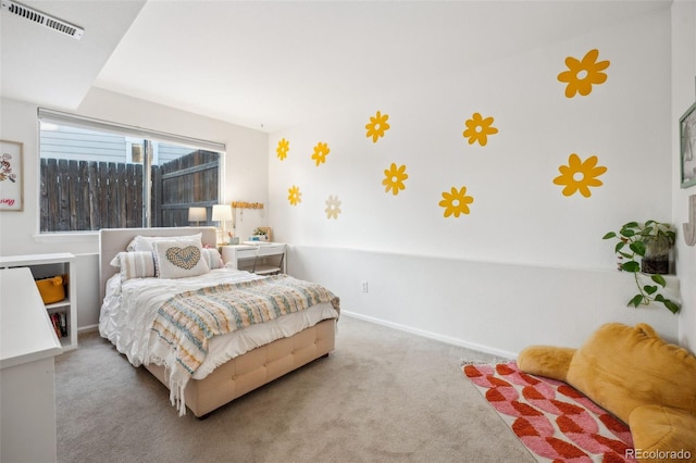 bedroom featuring baseboards, visible vents, and carpet flooring