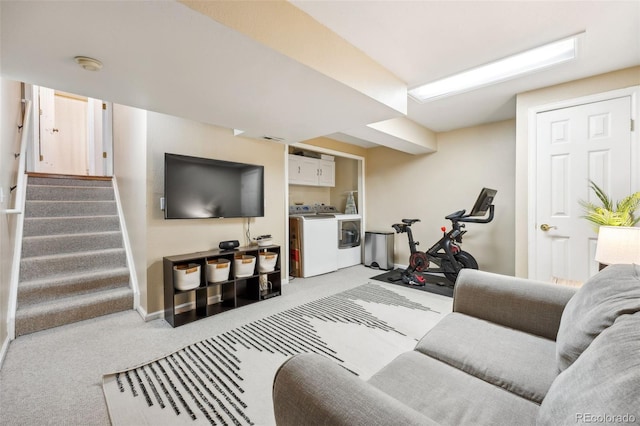 living room featuring stairs, washer and clothes dryer, and carpet flooring