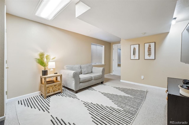 living room featuring carpet and baseboards