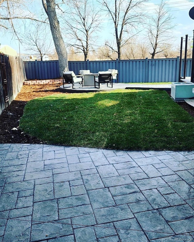 view of yard with a fenced backyard and a patio