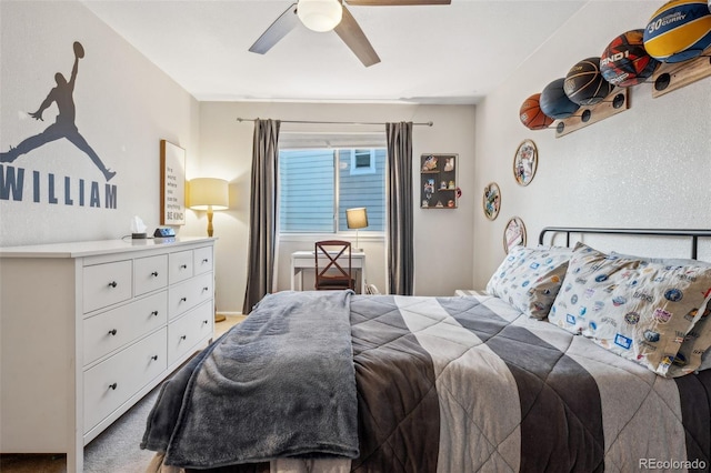 carpeted bedroom featuring ceiling fan