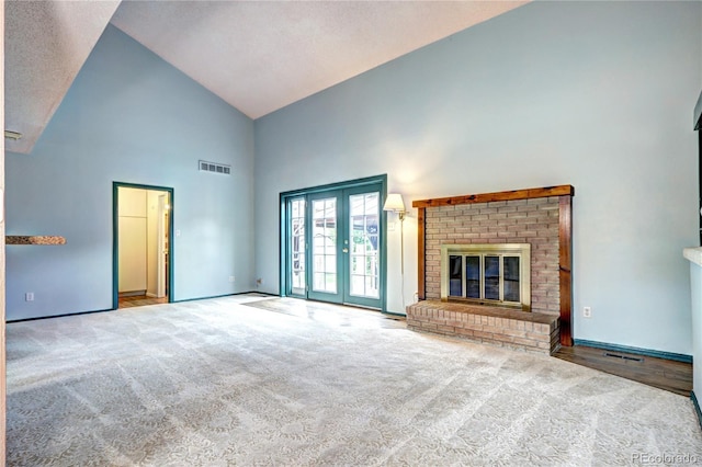 7300 Beech St, Arvada, CO 80005 - unfurnished living room featuring high vaulted ceiling, carpet, a fireplace, and baseboards