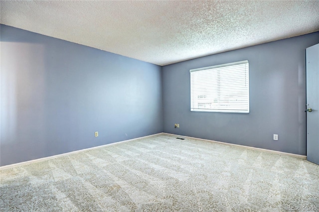 7300 Beech St, Arvada, CO 80005 - unfurnished room with carpet, a textured ceiling, and baseboards