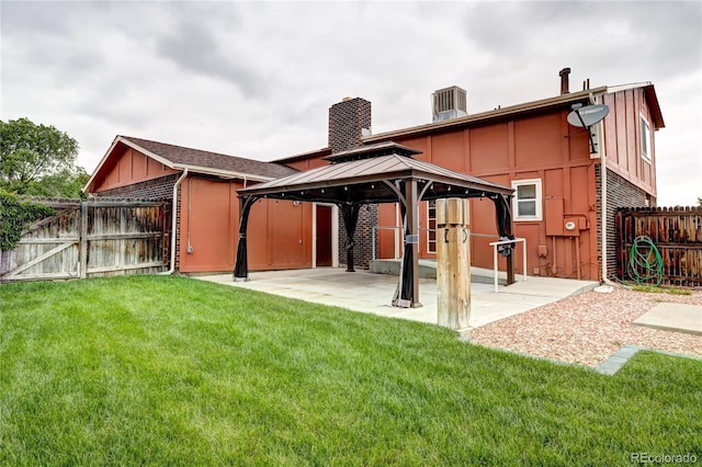 7300 Beech St, Arvada, CO 80005 - back of property featuring a gazebo, board and batten siding, a patio, central AC, and a gate