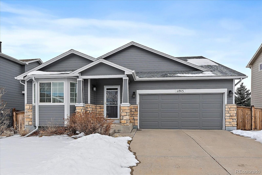 craftsman house with a garage