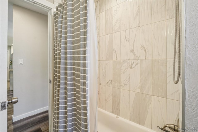 4715 Garland St, Wheat Ridge, CO 80033 - bathroom with shower / tub combo and wood finished floors