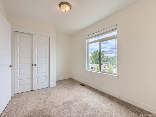2507 Moline St, Aurora, CO 80010 - unfurnished bedroom featuring carpet flooring, baseboards, and a closet