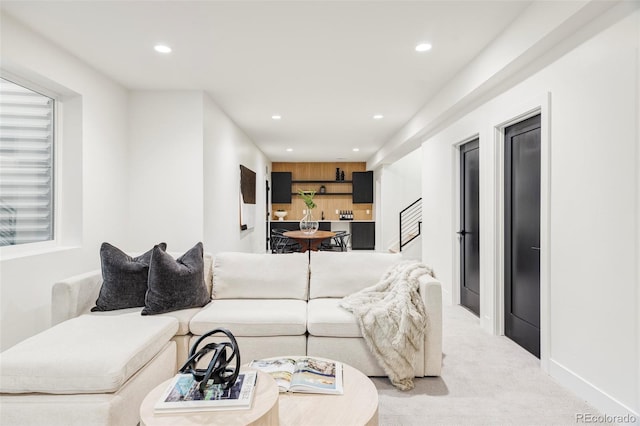 living room featuring light carpet