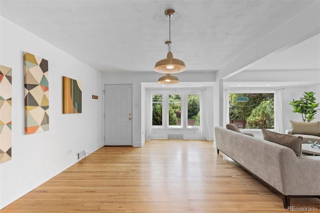 3209 E Yale Way, Denver, CO 80210 - entrance foyer with healthy amount of natural light and light wood-style flooring