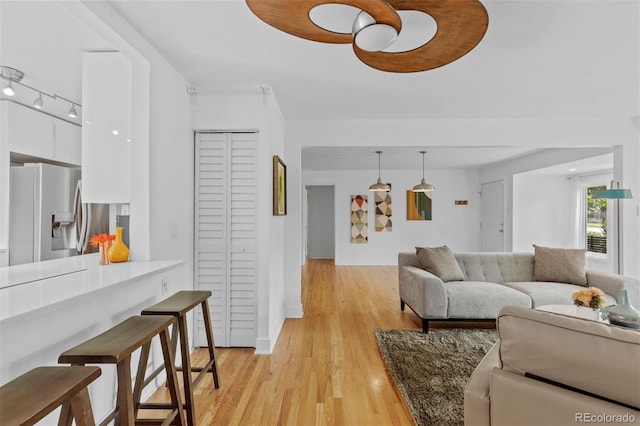 3209 E Yale Way, Denver, CO 80210 - living area featuring light wood finished floors and baseboards