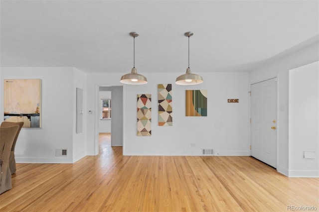 3209 E Yale Way, Denver, CO 80210 - unfurnished dining area with wood finished floors and baseboards