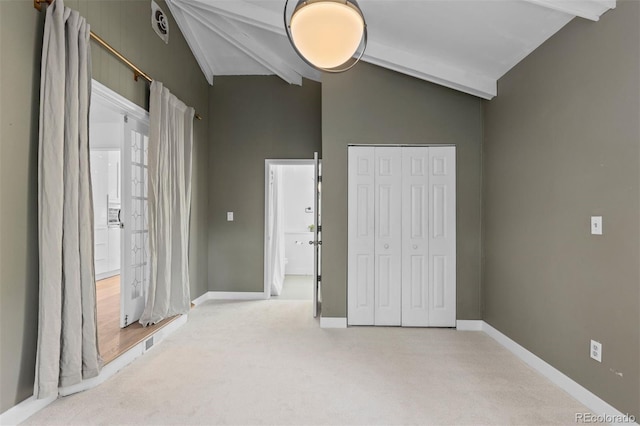 3209 E Yale Way, Denver, CO 80210 - unfurnished bedroom featuring beam ceiling, carpet floors, a closet, and high vaulted ceiling