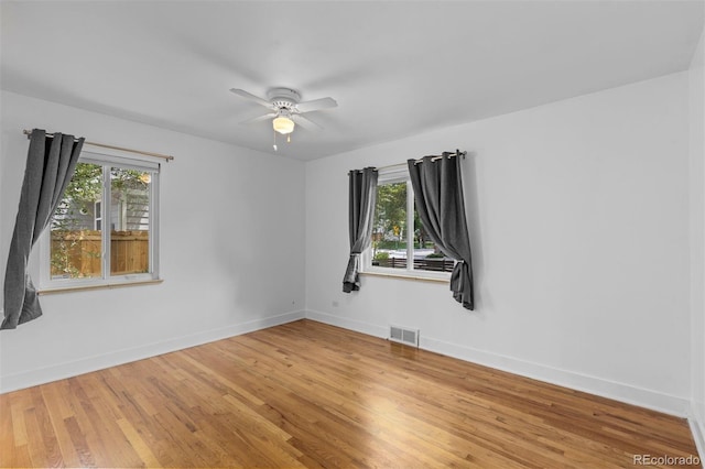 3209 E Yale Way, Denver, CO 80210 - empty room featuring light wood-type flooring and a ceiling fan
