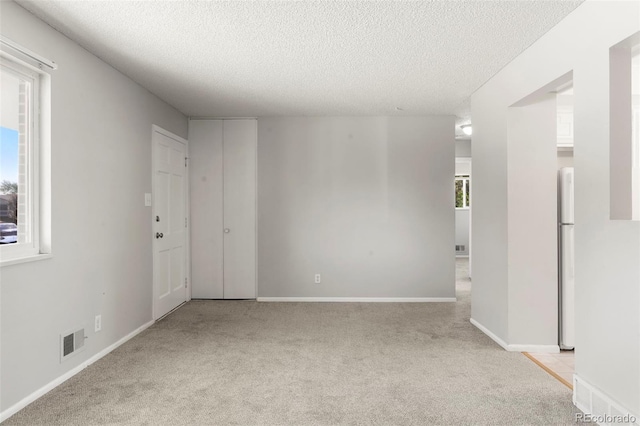 11917 Lavinia Way, Northglenn, CO 80233 - unfurnished room with a textured ceiling and light carpet