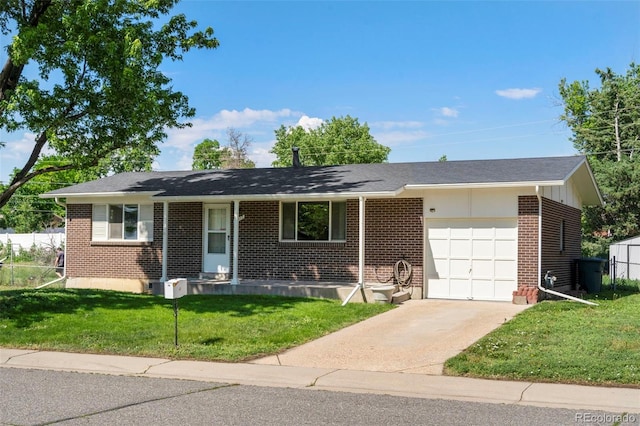 11917 Lavinia Way, Northglenn, CO 80233 - single story home featuring brick siding, a garage, a front lawn, and driveway