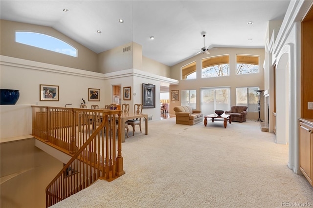 interior space with ceiling fan, high vaulted ceiling, visible vents, and recessed lighting