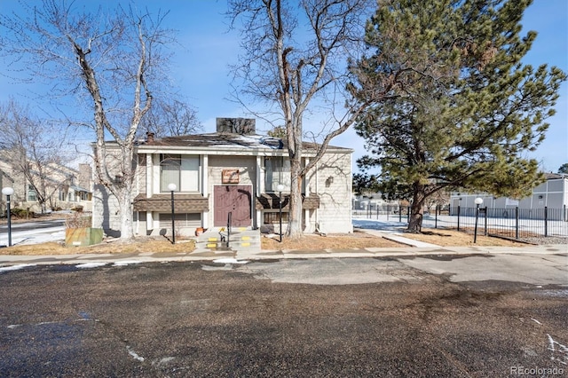 view of front of property featuring fence