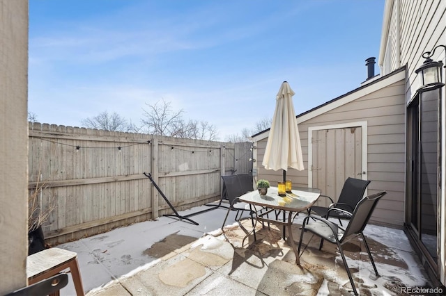 view of patio / terrace with outdoor dining space and a fenced backyard