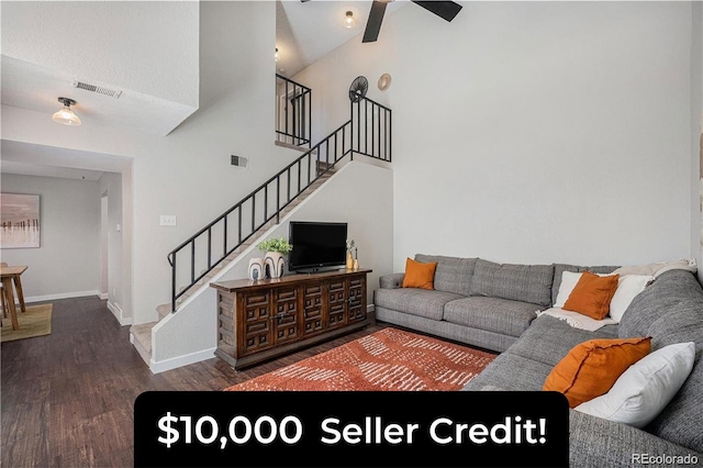7705 W 87th Dr, Arvada, CO 80005 - living area featuring wood finished floors, stairway, high vaulted ceiling, and ceiling fan