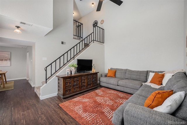 7705 W 87th Dr, Arvada, CO 80005 - living room featuring wood finished floors, high vaulted ceiling, stairway, and a ceiling fan