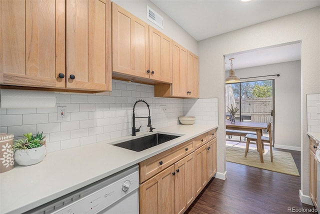 7705 W 87th Dr, Arvada, CO 80005 - kitchen featuring white dishwasher, light brown cabinets, decorative backsplash, and light countertops
