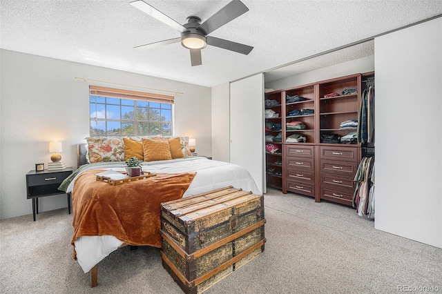 7705 W 87th Dr, Arvada, CO 80005 - bedroom with light carpet, a textured ceiling, and a ceiling fan