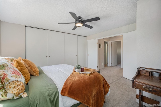7705 W 87th Dr, Arvada, CO 80005 - bedroom featuring light carpet, a closet, a textured ceiling, and ceiling fan