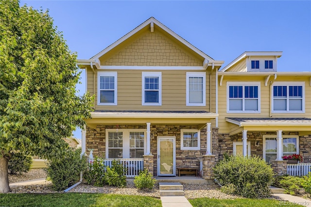 13626 Garfield St Unit A, Thornton, CO 80602 - view of front of home featuring a porch and stone siding