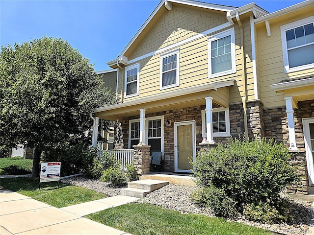 13626 Garfield St Unit A, Thornton, CO 80602 - view of front of home with a porch and stone siding