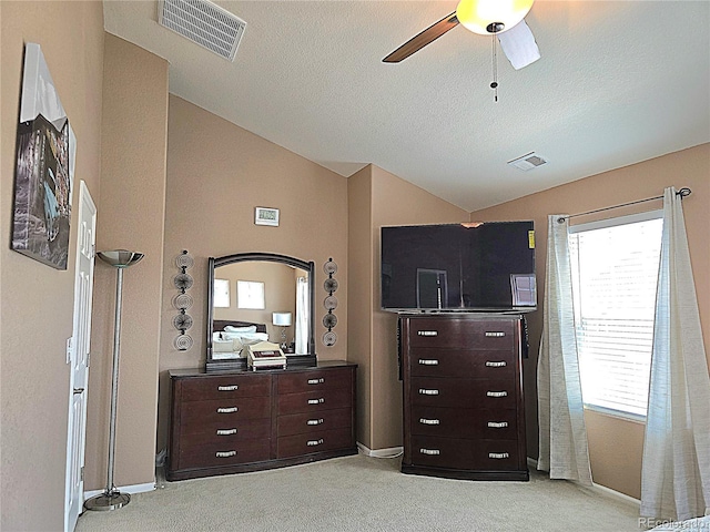 13626 Garfield St Unit A, Thornton, CO 80602 - bedroom with lofted ceiling, light carpet, a ceiling fan, and a textured ceiling