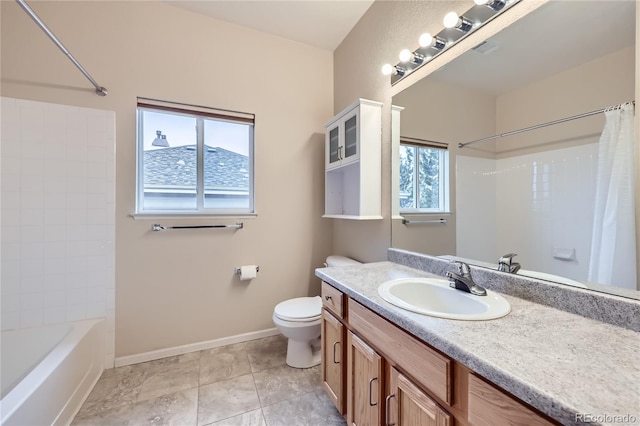 full bathroom with a wealth of natural light, vanity, shower / tub combo, and toilet