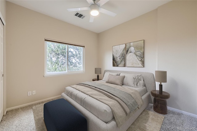 bedroom with light carpet and ceiling fan