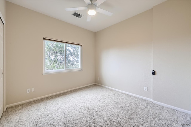 unfurnished room with ceiling fan and carpet floors