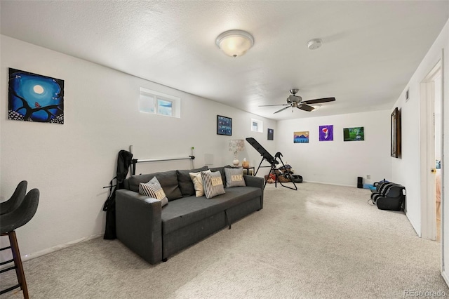 living room featuring carpet and a ceiling fan